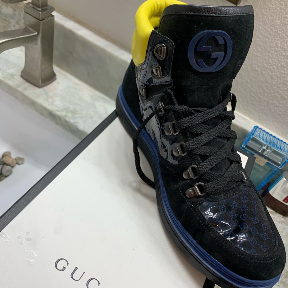Men’s black, yellow , blue Gucci shoes.